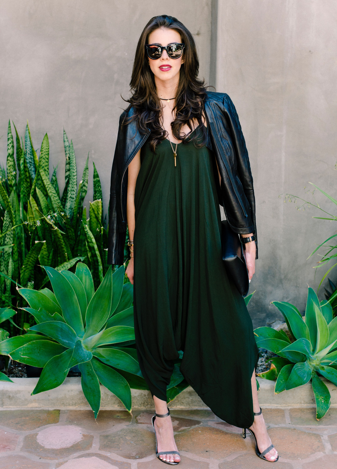 Jackie Roque styling a Urban Outfitters jumpsuit, Trouve leather jacket, a Giving Key, and Joie Shoes