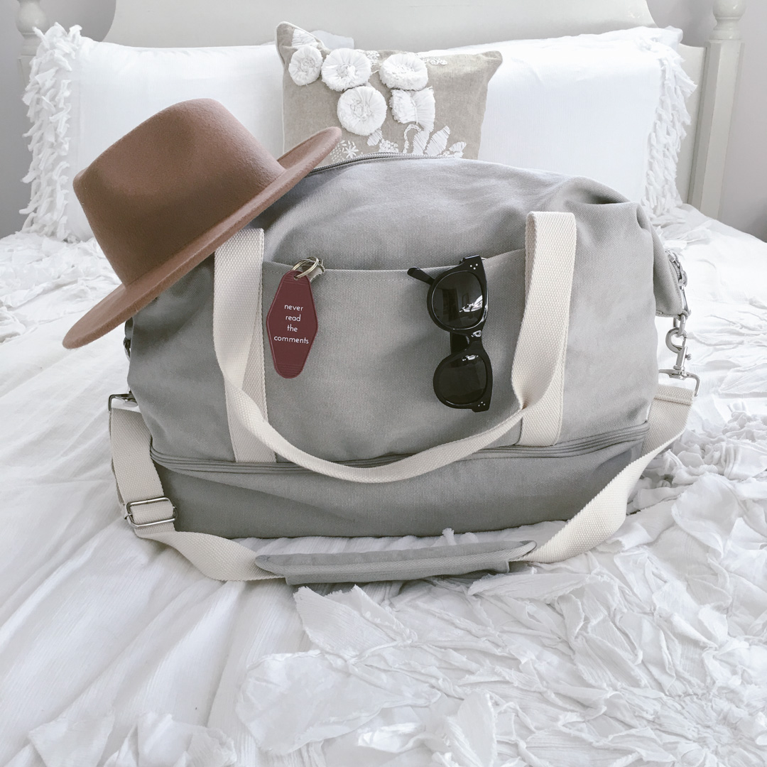 Packing tips from Dash Of Panache featuring a Lo and Sons Catalina Weekender Deluxe on an Anthropologie Florette duvet and Celine sunglasses