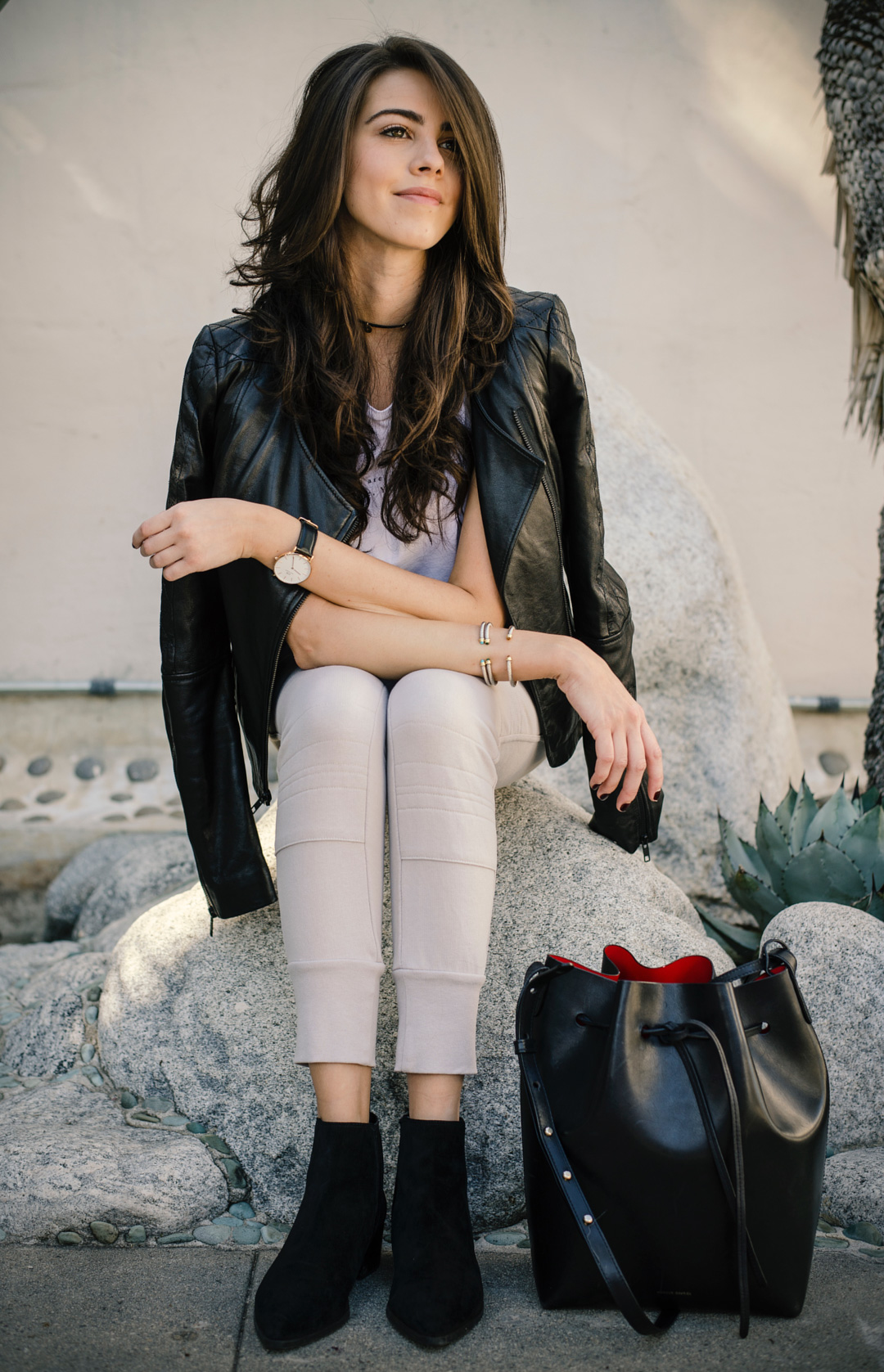 Jackie Roque styling Sincerely Jules Joggers, Mansur Gavriel Bucket Bag and a leather jacket