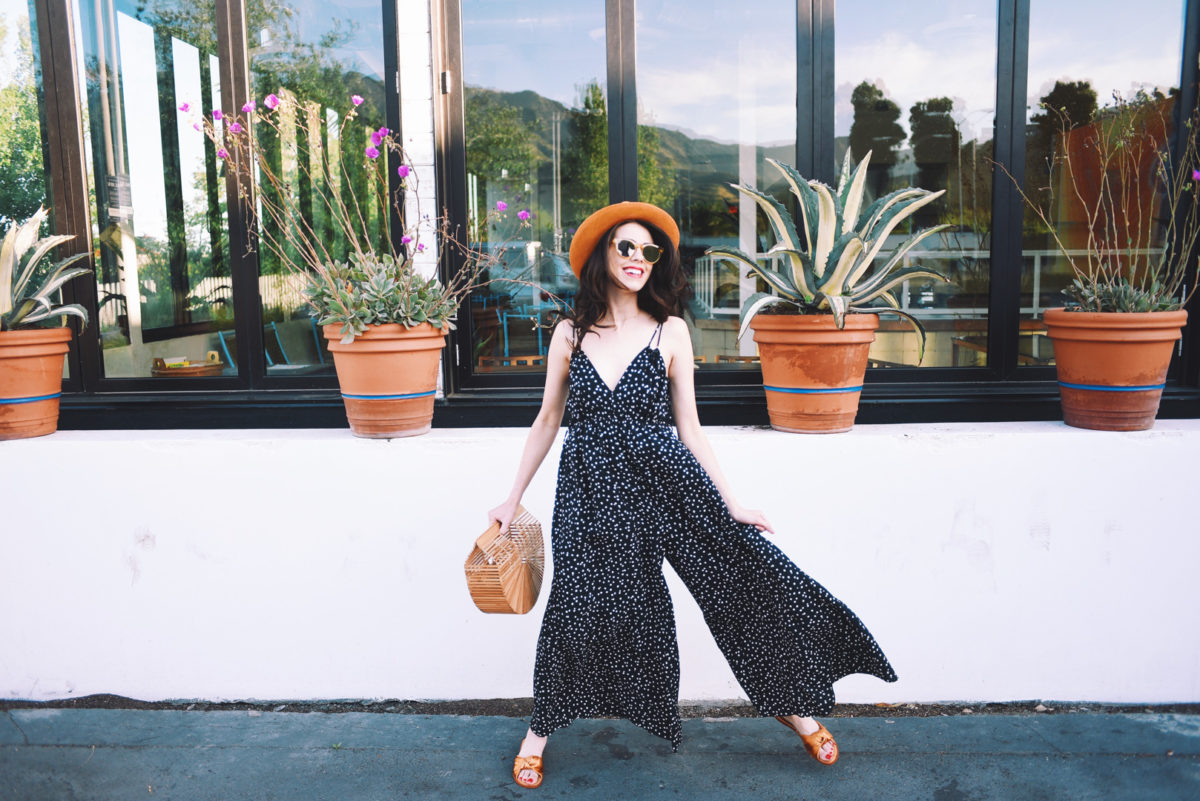 Jackie Roque styling a polkadot jumpsuit and knotted sandals in Malibu.