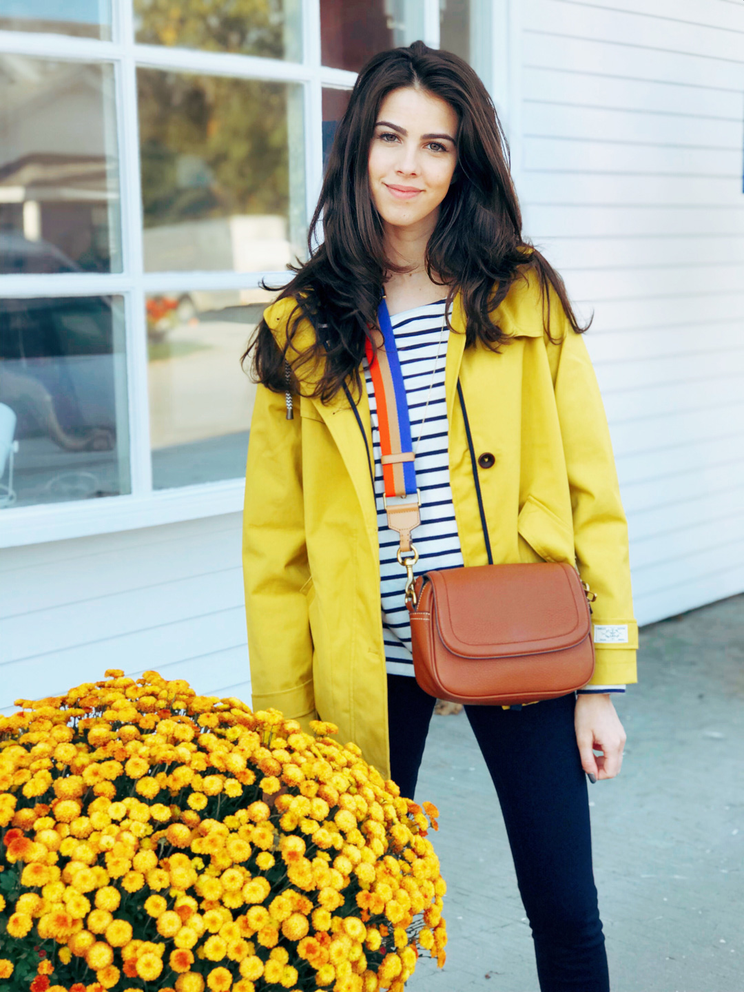 Jackie Roque styling a yellow raincoat in Manchester Vermont.