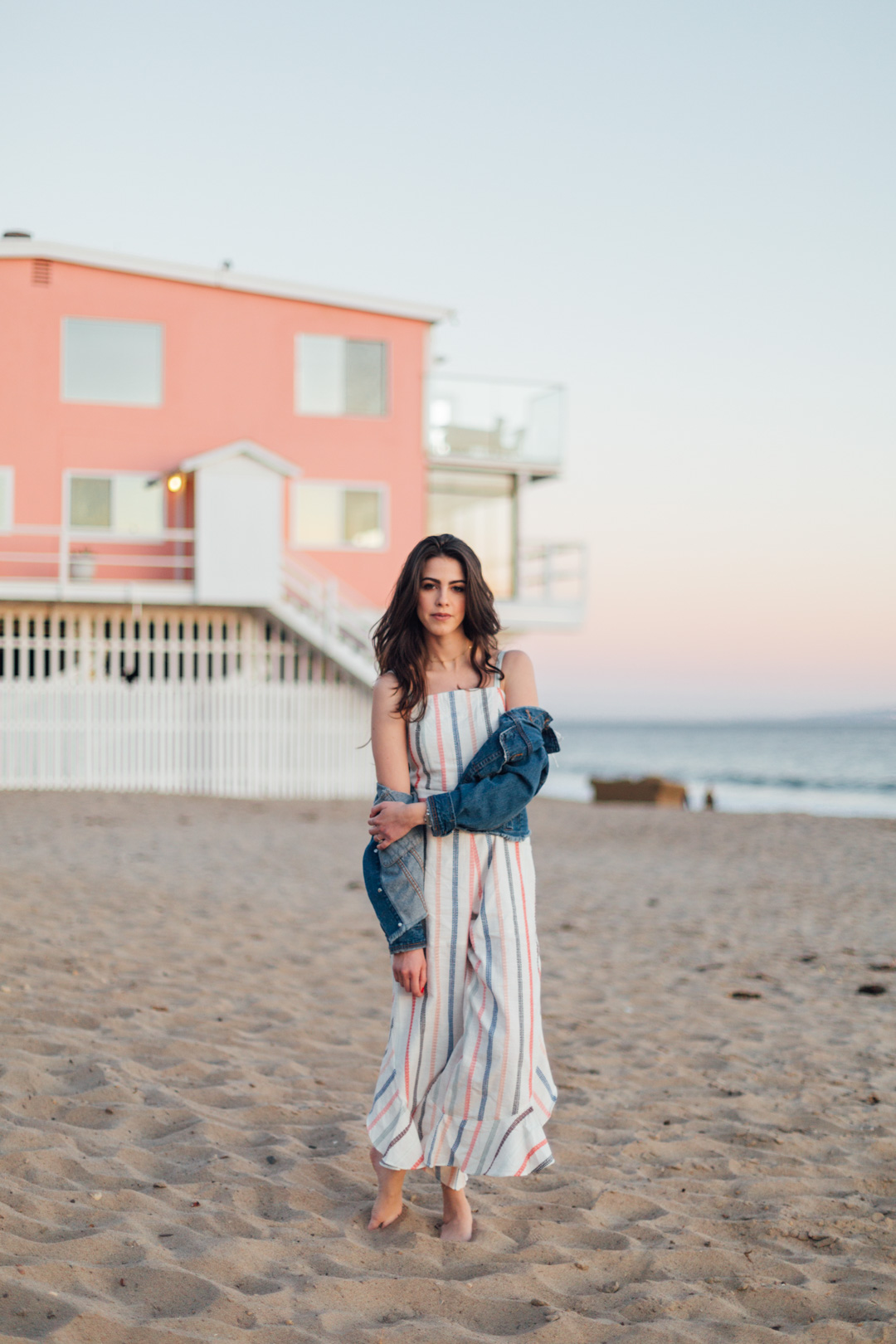 Jackie roque styling a Red Carter Everly Jumpsuit in Malibu California.