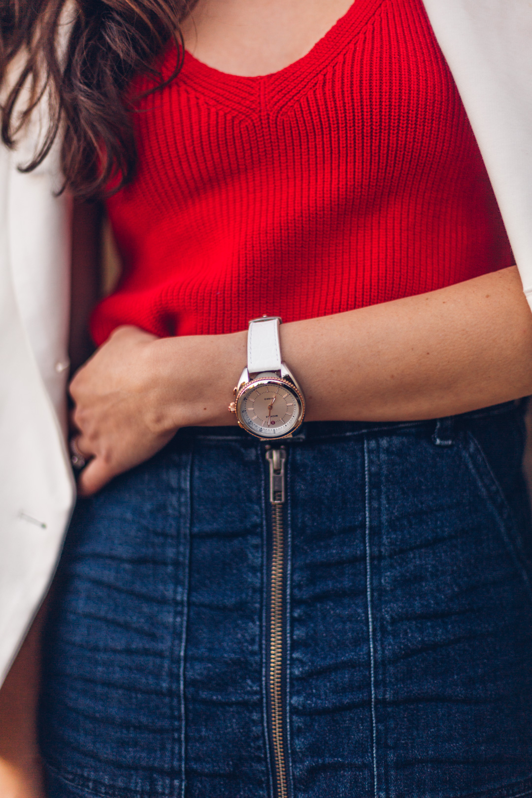 Jackie Roque styling a 4th of July outfit with a white Hybrid MICHELE Watch in Malibu, California.