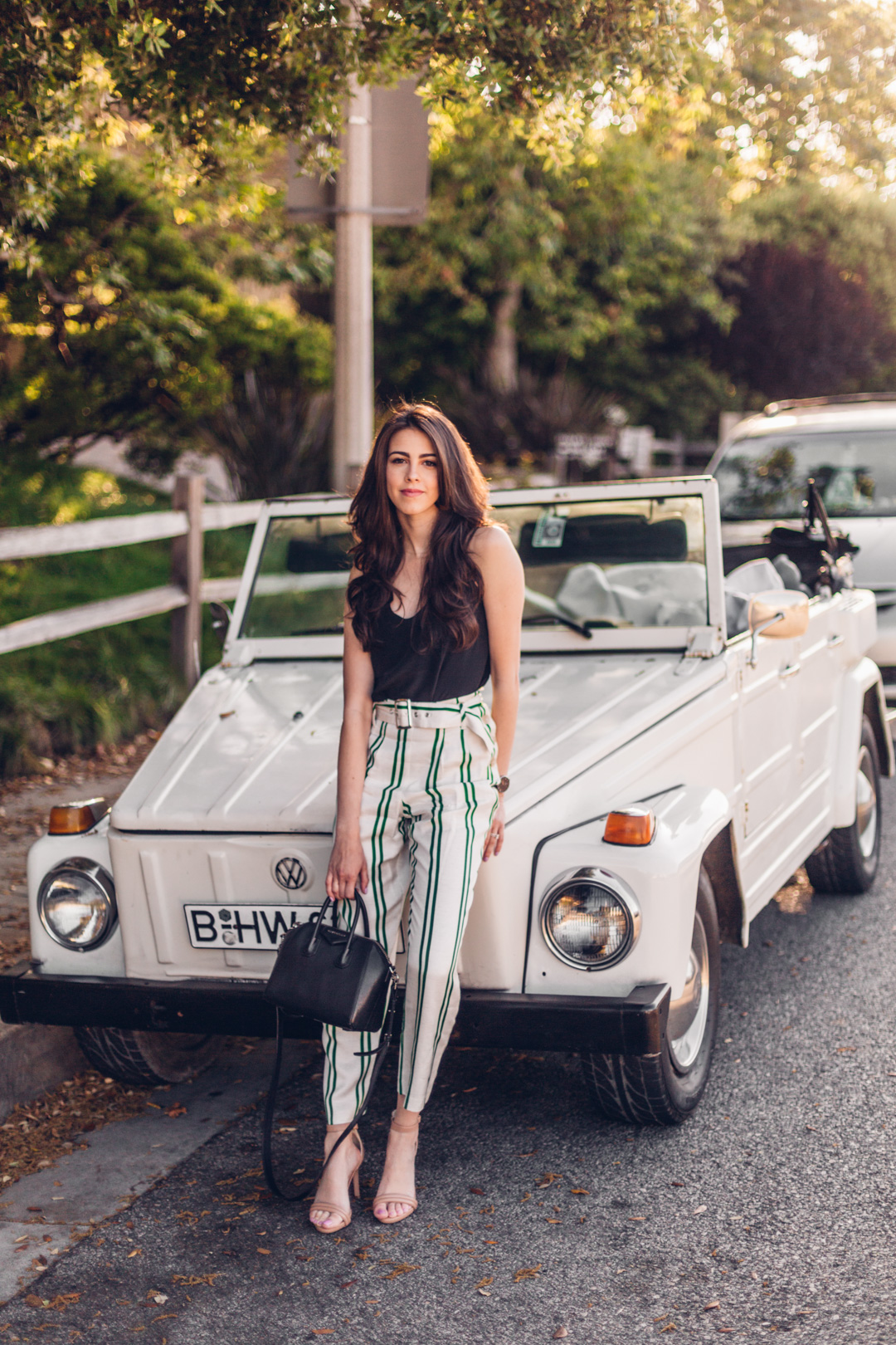 Jackie Roque styling a Topshop stripe pant, Habitual Top and Givenchy bag in Malibu.