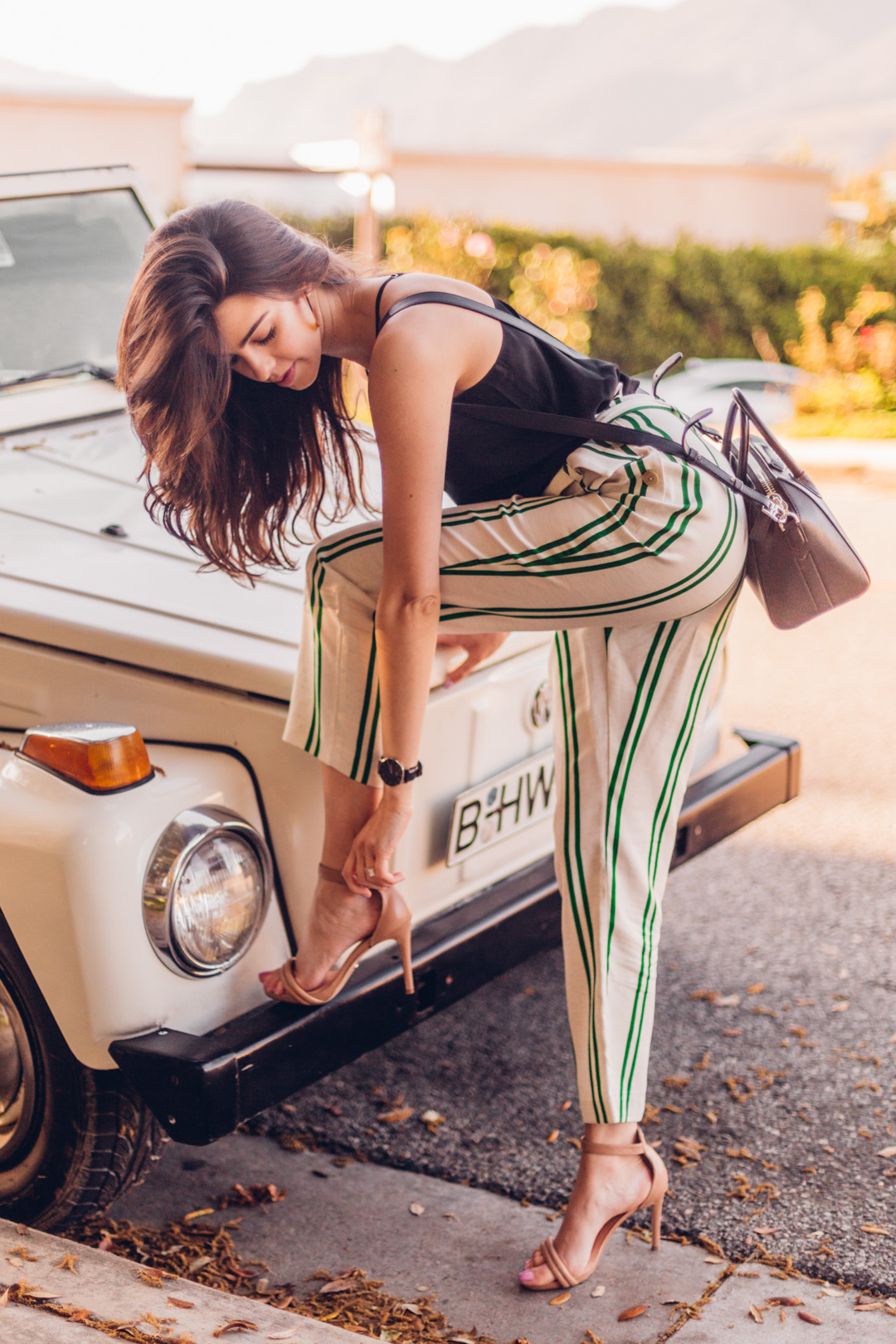 Jackie Roque styling a Topshop stripe pant, Habitual Top and Givenchy bag in Malibu.