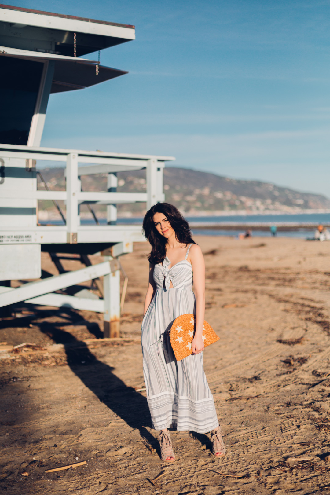 Jackie Roque Salas styling a Red Carter Striped Jumpsuit in Malibu.