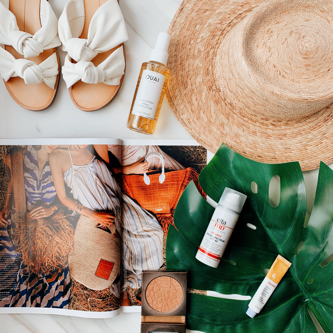 Jackie shares her summer 2019 beauty, fashion and lifestyle essentials- featuring the Ouai Wave Hair spray, Lack of Color Hat, Elta MD face sunscreen and glossier mango balm dot com.