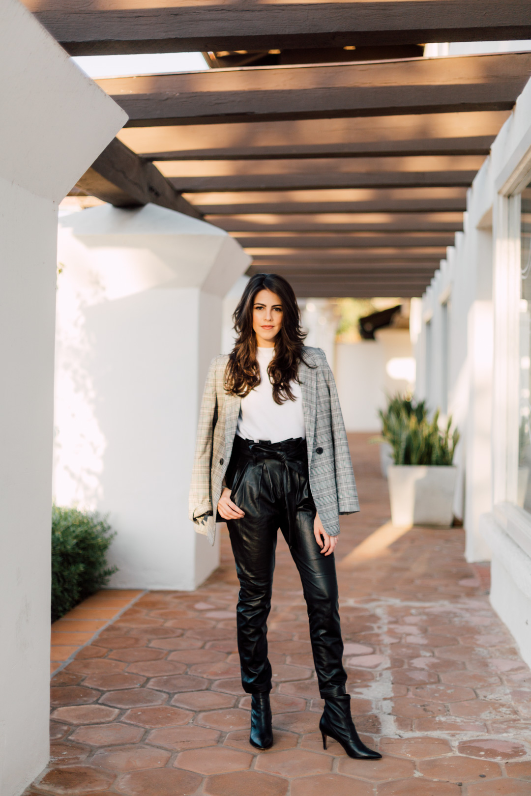 Jackie Roque Salas styling leather pants, Anine Bing blazer and a white tee in Malibu.